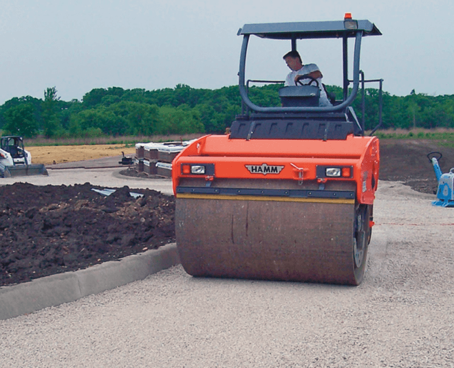 Figure 2. A 10-ton roller compactor operates in vibratory mode, then static mode until there is no visible aggregate movement.